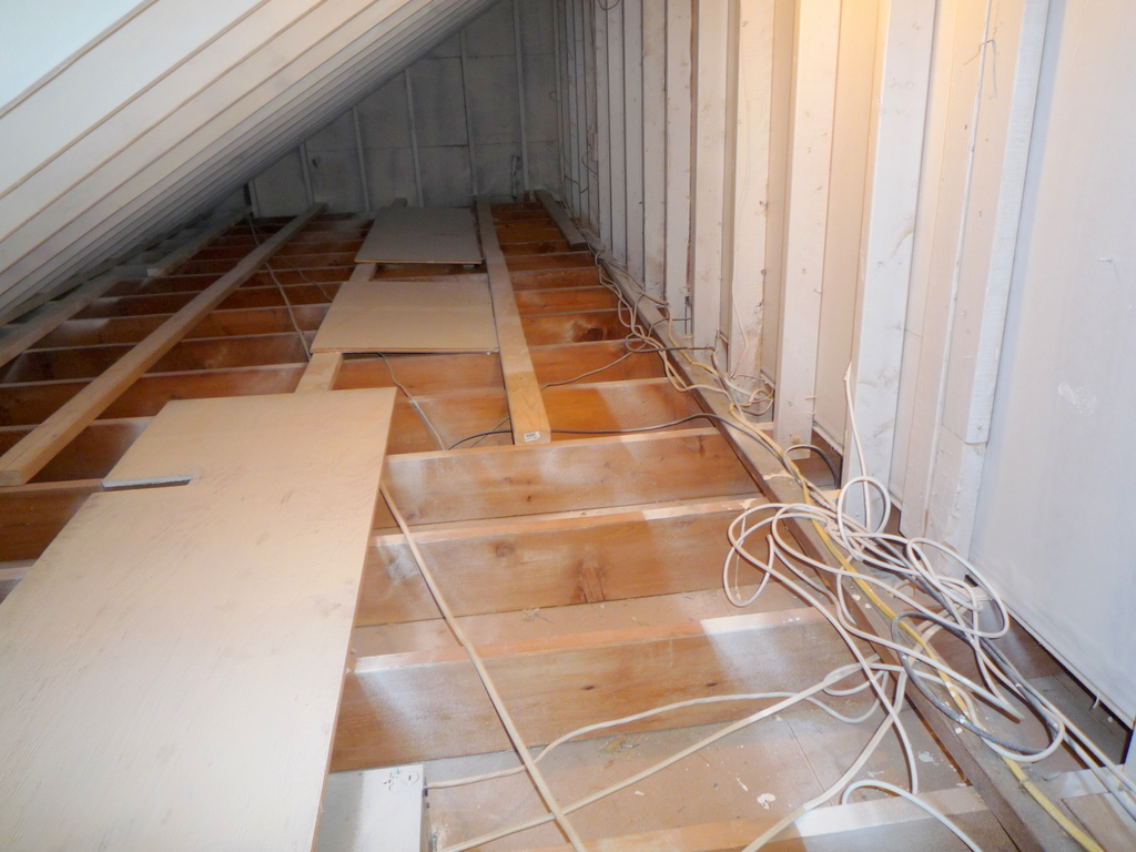 Walk-in closet behind a knee-wall